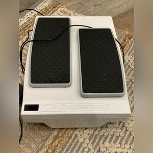 Legxercise Machine in Black and White for blood circulation and movement.